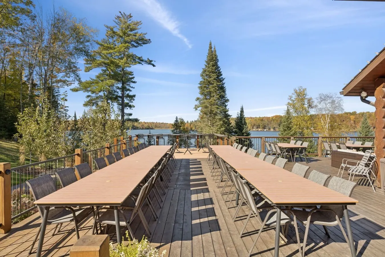 Long tables set on the lakeside deck