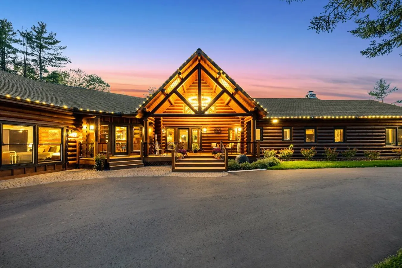 The log lodge lit up at dusk